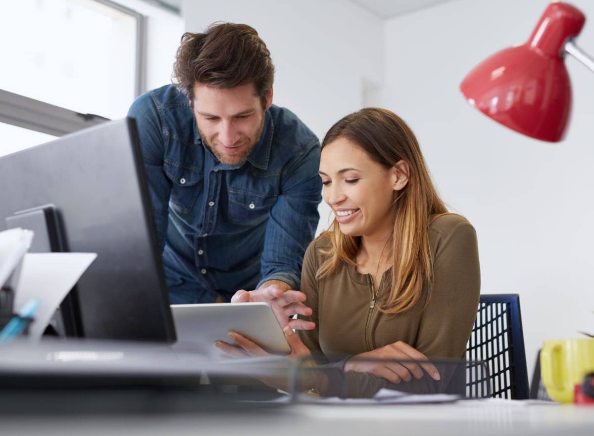 Two marketing experts collaborating on a digital project